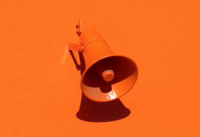 orange megaphone on an orange background